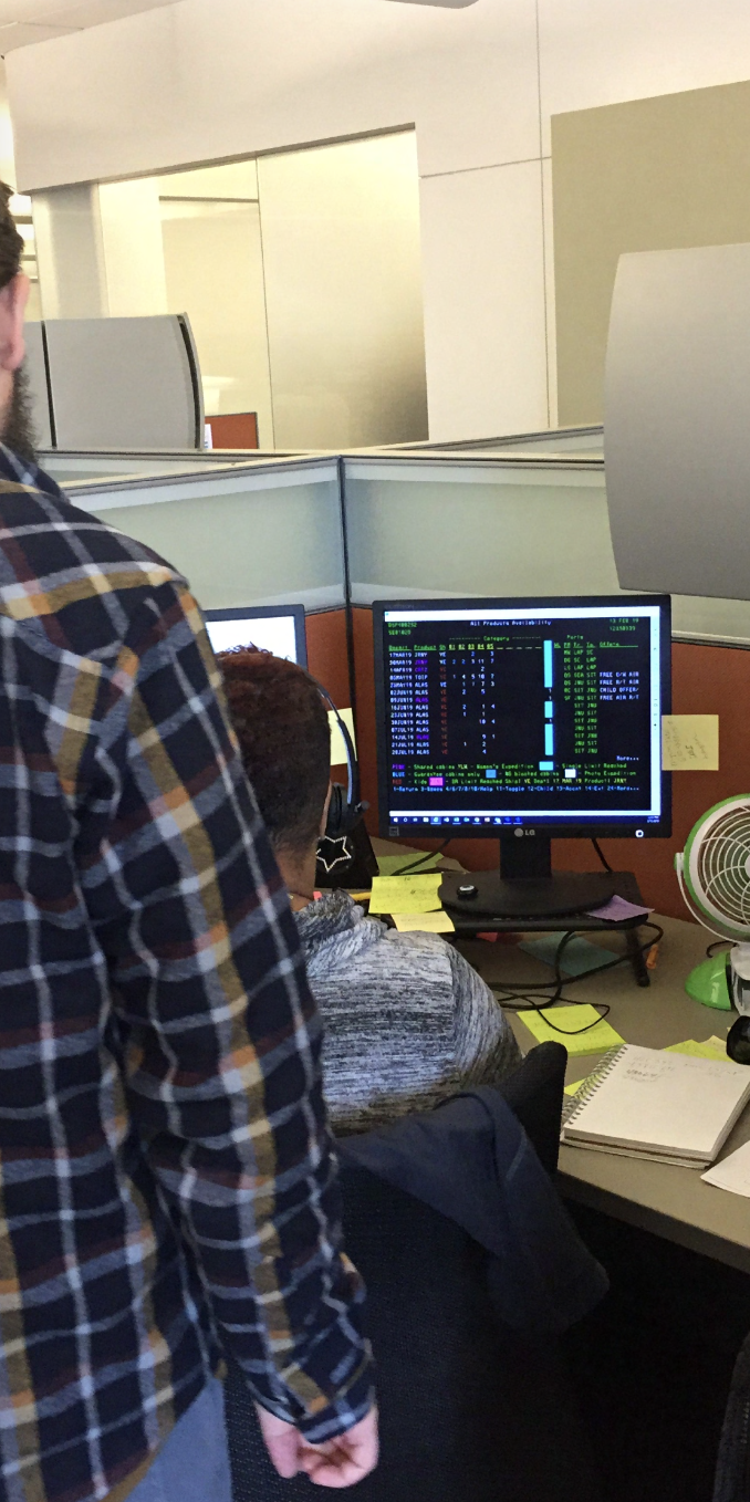 Field research at Lindblad's New York head office — observing the reservations team operate the legacy mainframe terminal.